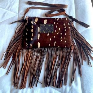 Upcycled LV cowhide crossbody bag.  Adjustable strap, fringe, gorgeous color.